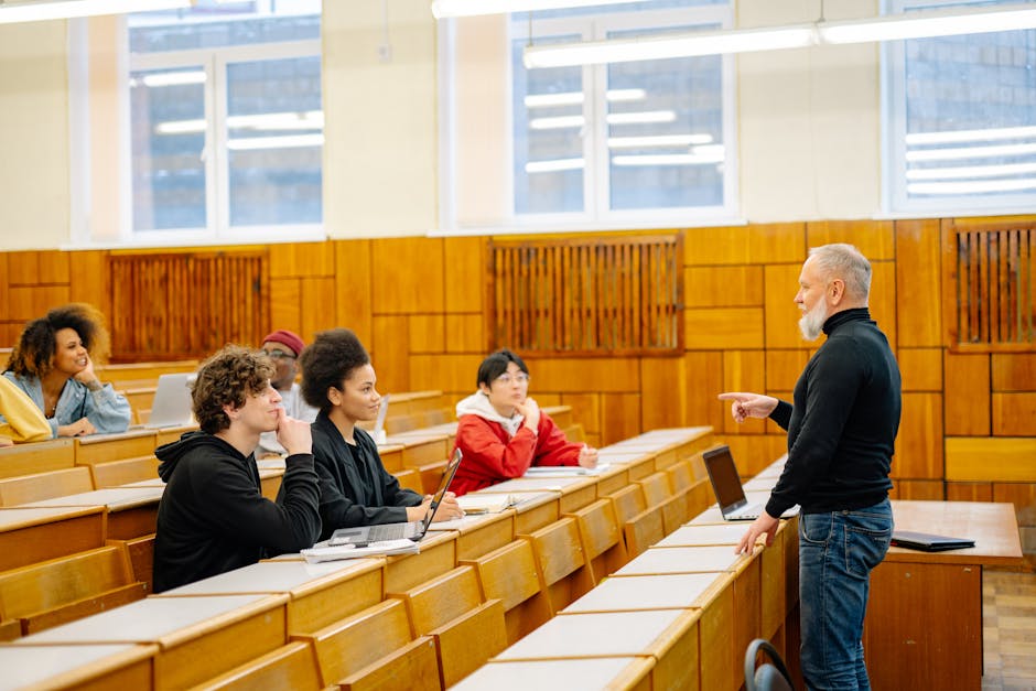 A diverse group of university students engaging with a professor during a classroom lecture